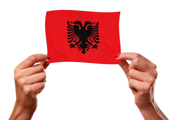 Den Albanska flaggan i kvinna händer — Stockfoto