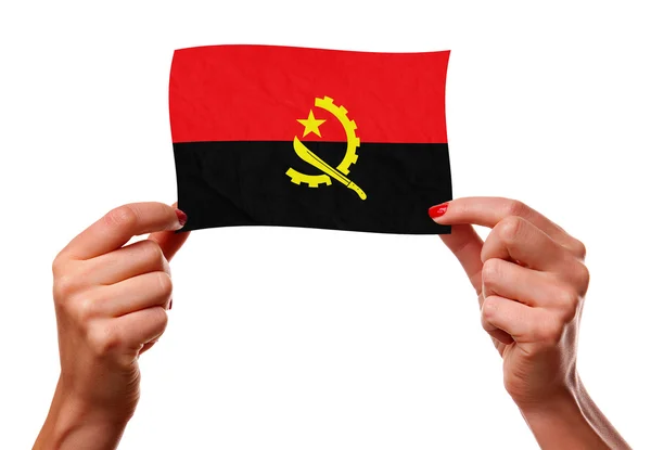 De Angolese vlag in de handen van de vrouw. — Stockfoto