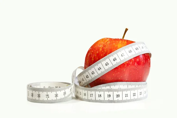 stock image Measure tape and red apple isolated