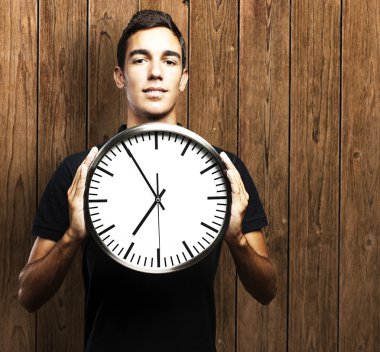 Man holding clock clipart