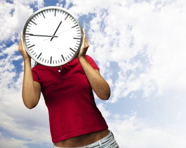 Woman holding clock clipart