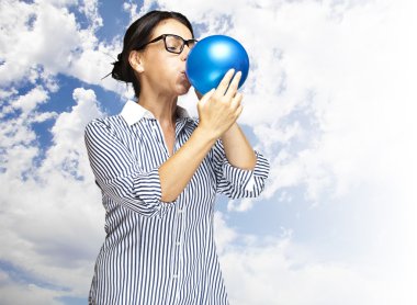 Woman blowing balloon clipart