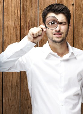 Man with magnifying glass clipart