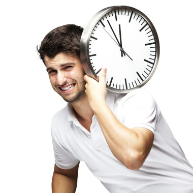 Portrait of a handsome young man carrying a clock against a whit clipart