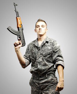 Young soldier aiming clipart