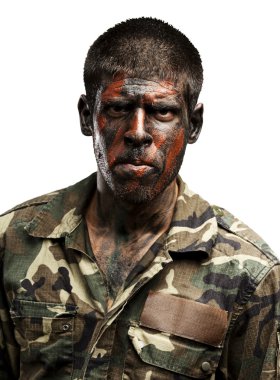 Young soldier with camouflage paint looking very serious over wh clipart