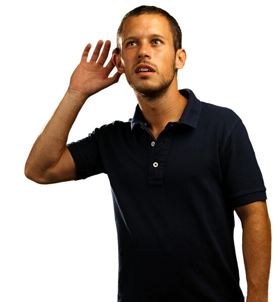 Young man hearing sounds on white background
