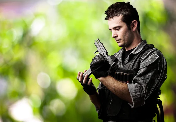 Young soldier reloading — Stock Photo, Image
