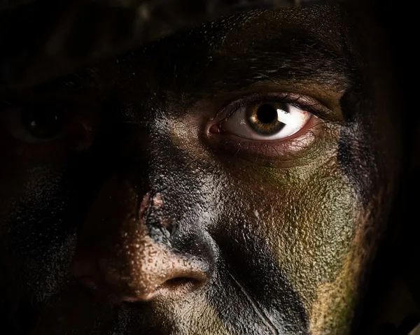 Camouflage painted face — Stock Photo, Image
