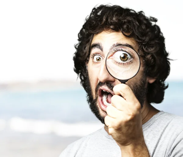 Man with magnifying glass — Stock Photo, Image