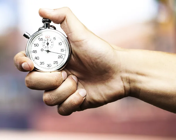 Hand bedrijf stopwatch — Stockfoto