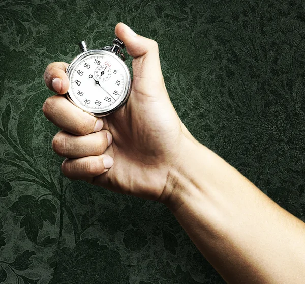 stock image Hand holding stopwatch