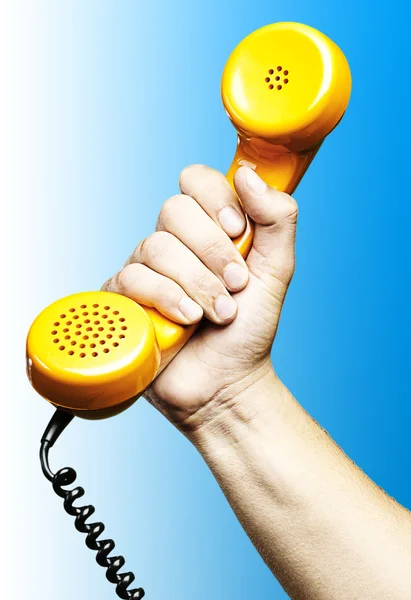 Hand holding telephone — Stock Photo, Image