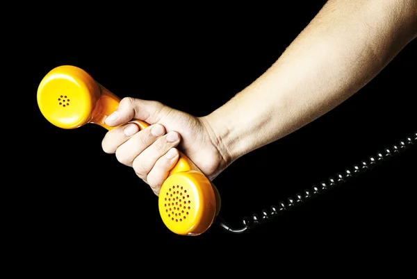 Hand som håller en vintage telefon — Stockfoto