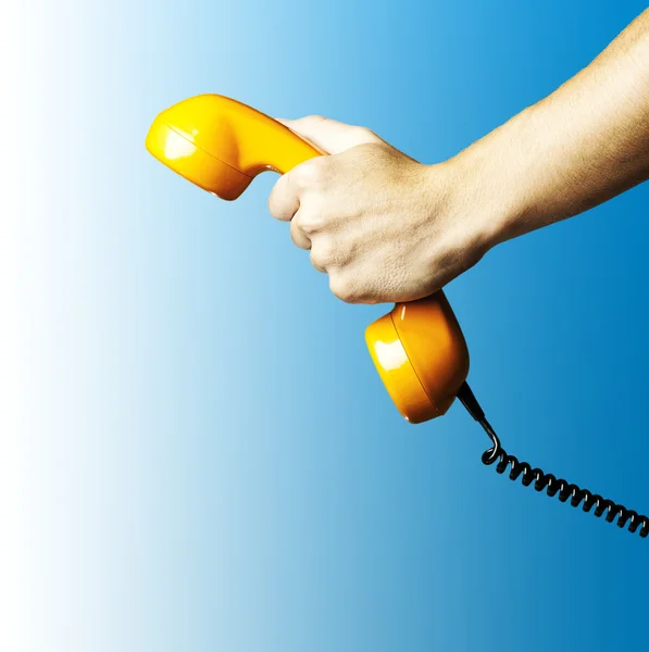 Hand holding a vintage telephone — Stock Photo, Image