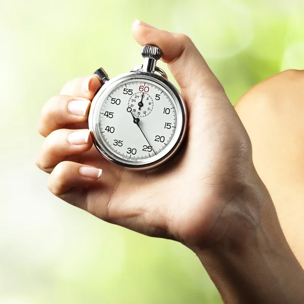 Woman pushing stopwatch — Stock Photo, Image