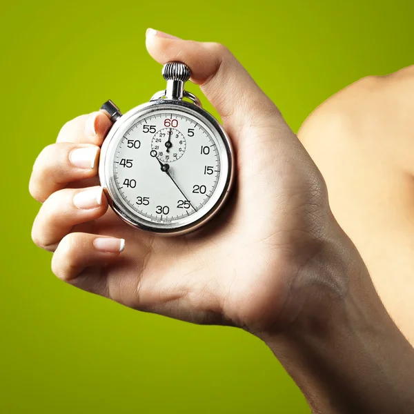 Woman pushing stopwatch — Stock Photo, Image