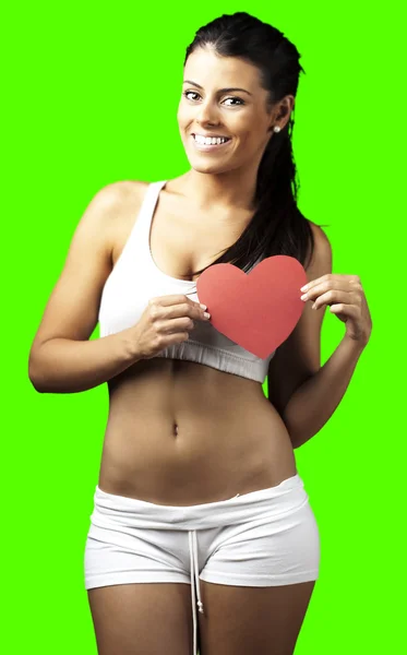 Kvinna som håller hjärtat symbol — Stockfoto
