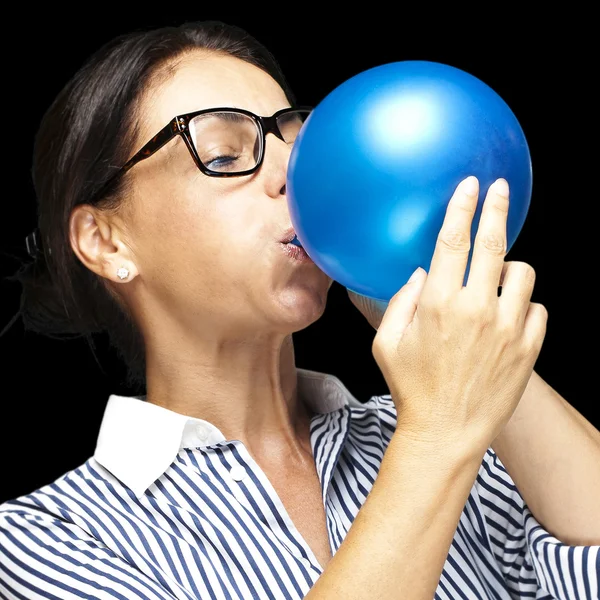 Middle aged blowing — Stock Photo, Image