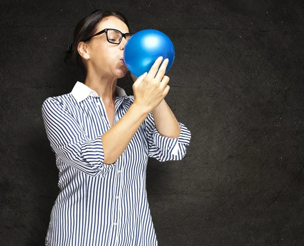 stock image Woman blowing balloon