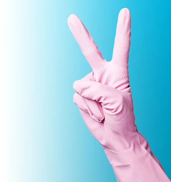 Розовые чистящие перчатки — стоковое фото