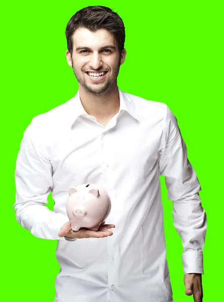 Man bedrijf piggy bank — Stockfoto