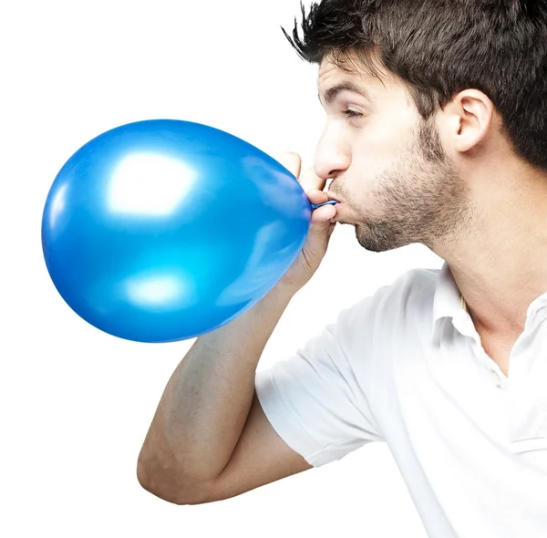 Homem soprando balão — Fotografia de Stock