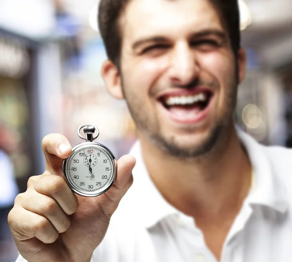 Man holding stopwatch — Stock Photo, Image