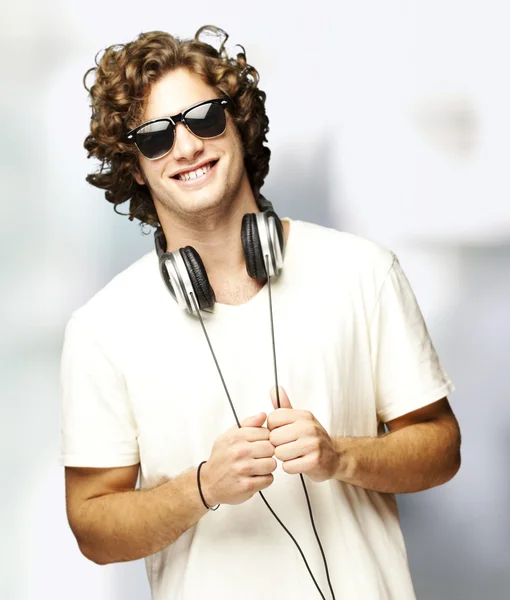 Portrait of young man with headphones indoor — Stock Photo, Image
