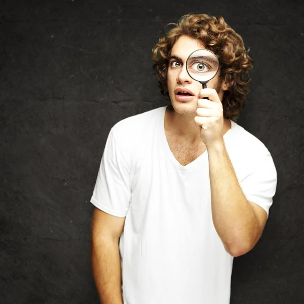 Man with magnifying glass — Stock Photo, Image