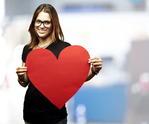 Woman holding heart — Stock Photo, Image