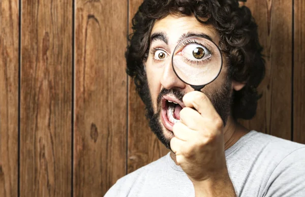 Man with magnifying glass Stock Picture