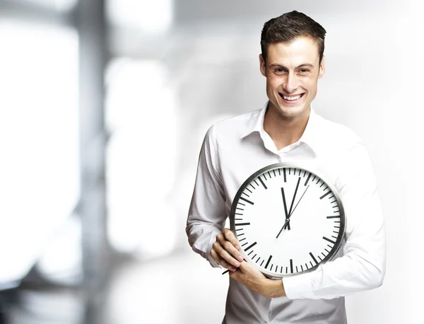 Man holding clock Stock Image