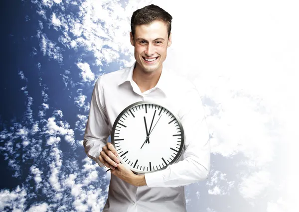 Man holding clock Royalty Free Stock Images