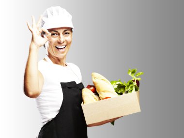 Woman carrying groceries clipart