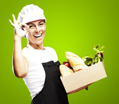 Woman carrying groceries clipart