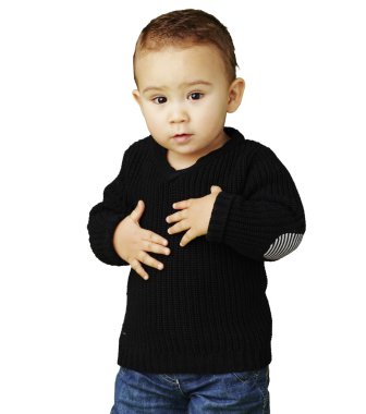 Portrait of adorable kid touching his stomach against a white ba clipart