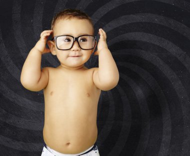 Portrait of funny kid shirtless wearing glasses against a grunge clipart