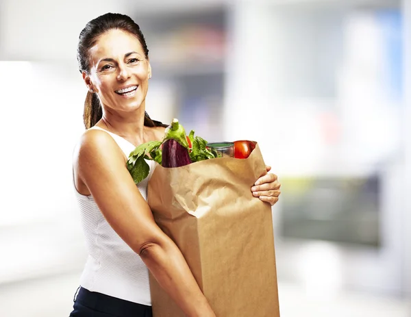 Woman with purchase — Stock Photo, Image