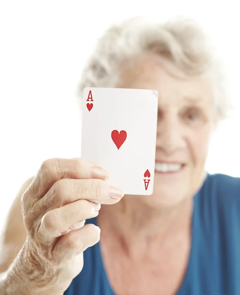 Senior woman playing poker — Stock Photo, Image