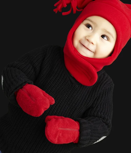 Portrait of an adorable kid smiling wearing winter clothes — Stock Photo, Image