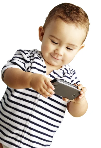 Retrato de criança engraçada brincando com celular sobre fundo branco — Fotografia de Stock