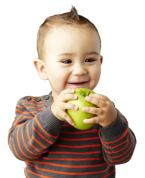 Portrait of funny kid holding green apple and smiling over white — Stock Photo, Image