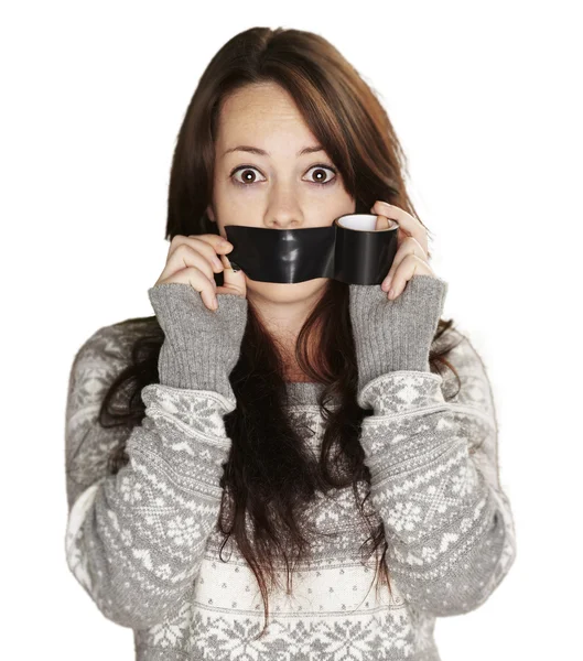 Portrait of scared girl being silenced by herself over white bac — Stock Photo, Image