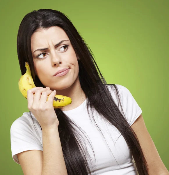 Woman with a banana phone — Stockfoto