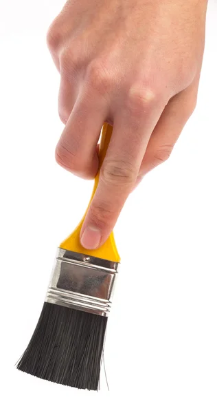 Mão segurando um pincel — Fotografia de Stock