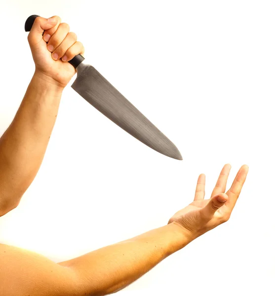 Нож и рука — стоковое фото