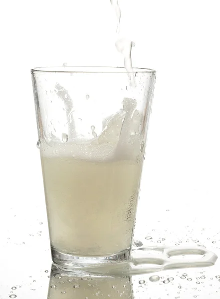 Pouring refreshment on glass — Stock Photo, Image