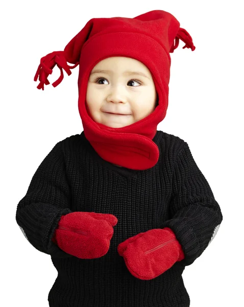 Portrait of an adorable kid smiling wearing winter clothes Stock Picture