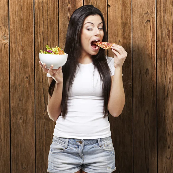 Woman eating pizza Stock Image